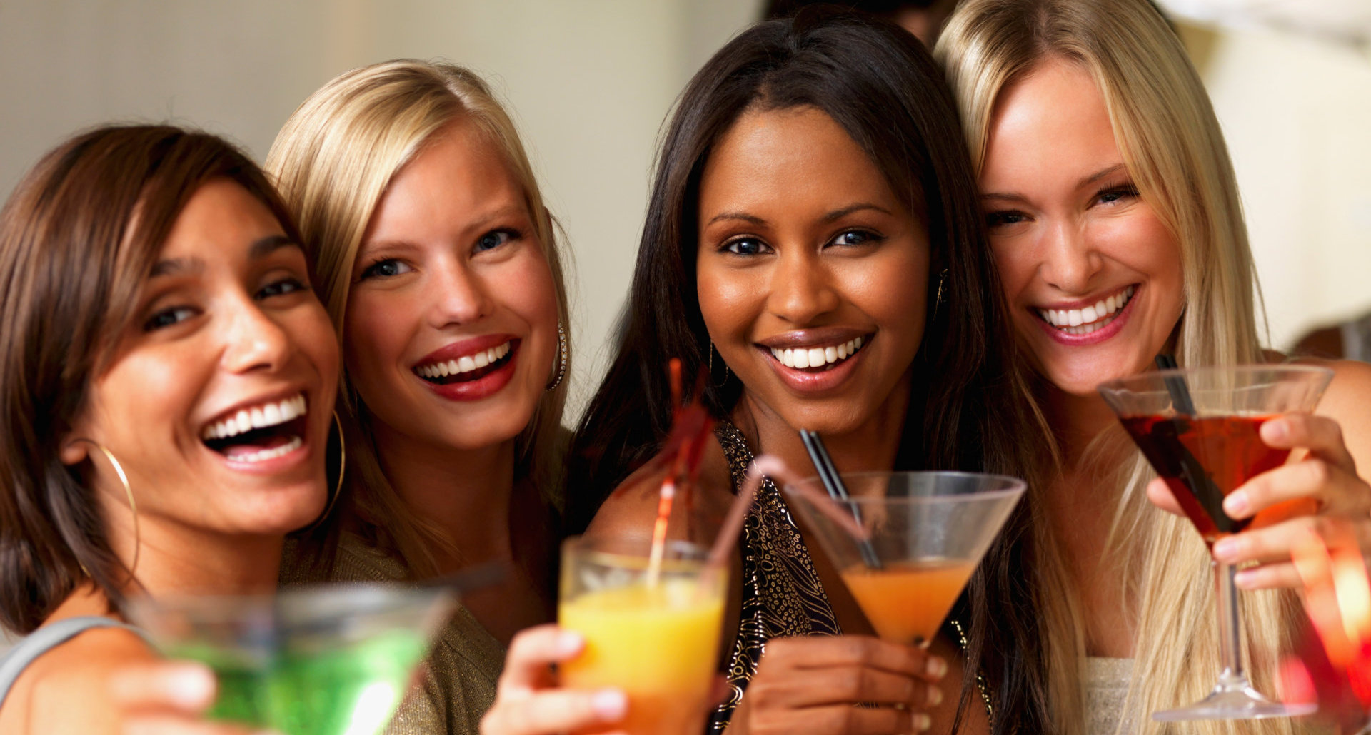 Young girls holding drinks